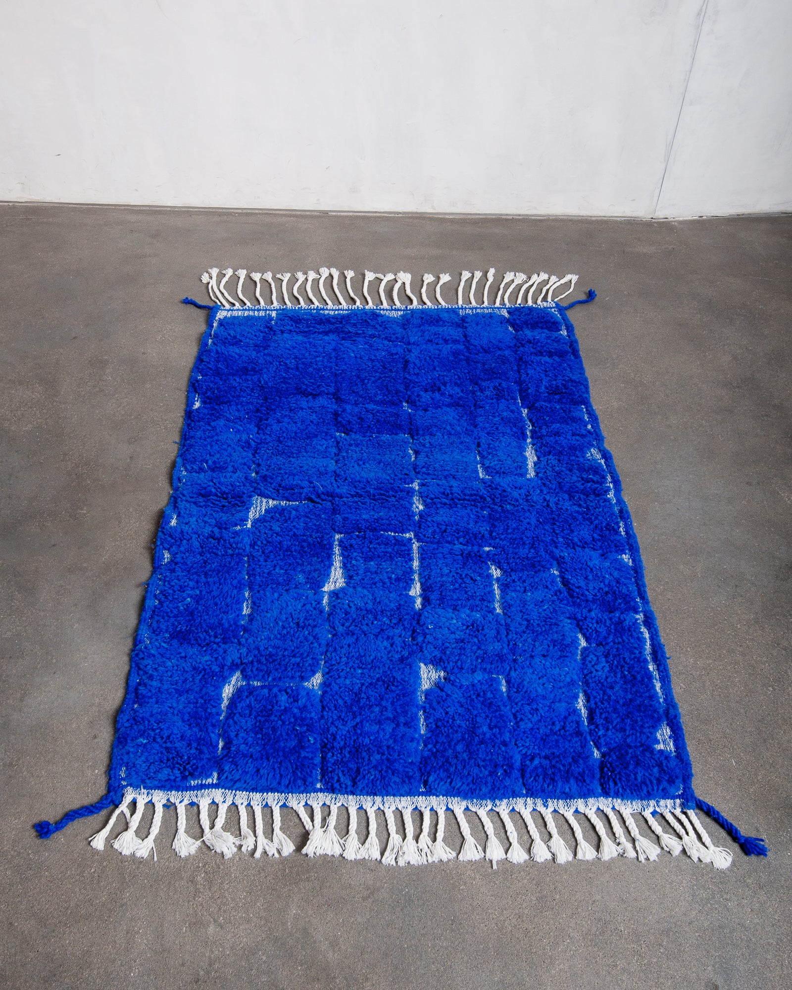 Modern, designer, handcrafted Berber rug from Morocco. Beniourain carpet with beautiful colours and patterns and fluffy wool texture.